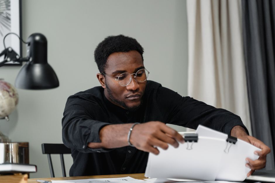 A person organizing their important documents at home